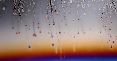 Macro Abstract Liquid Soap Film with Flowing Drops and Iridescent Rainbow Stock Footage 346168592