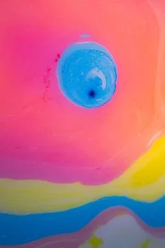 Macro abstract representation of a blue liquid drop forming. Stock Photos