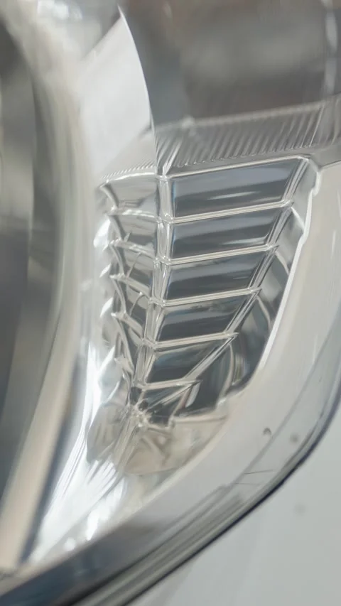 A macro abstract shot of shiny chrome car headlight interior reflectors Stock Footage 336710809