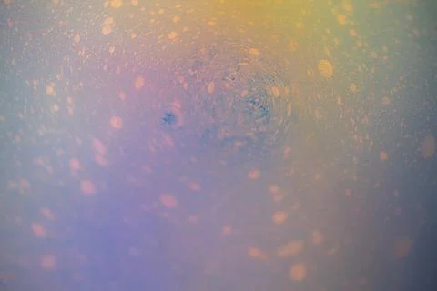 A macro abstract view of pastel liquid with delicate, bubble-like. Stock Photos