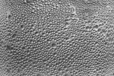 Macro of abstract water drops on background texture. Stock Photos