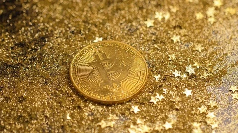 Macro Amazing Gold Bitcoin Model Lays among Sparkles Stock Footage 83560541