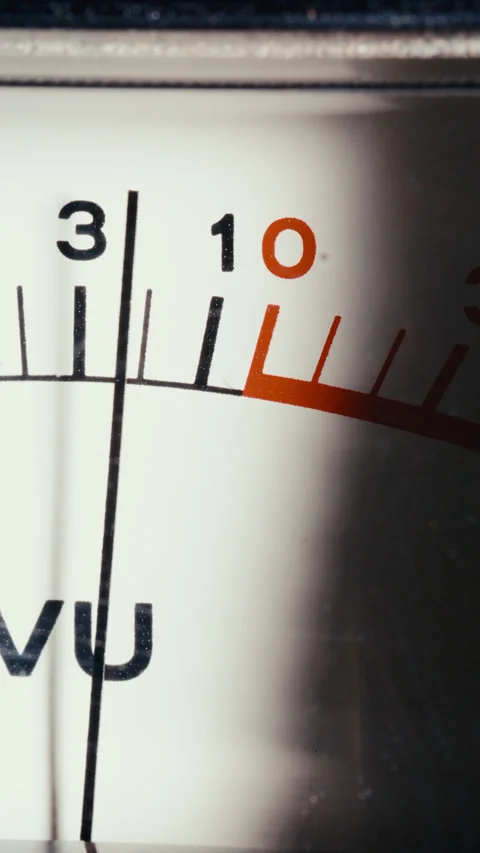 Macro of Analog VU Meter Display with Needle Peaking into Red Zone 库存影片 342446507