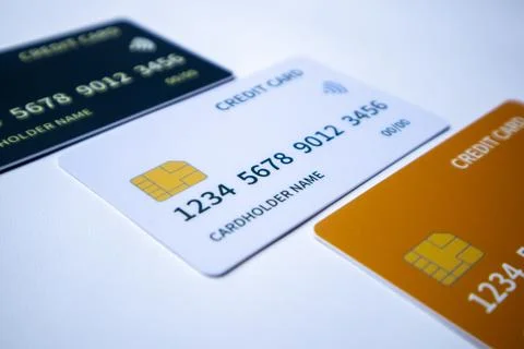 Macro angled diagonal sequence of black, white, and orange credit and debit.. Stock-Fotos
