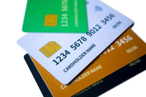 Macro angled shot of overlapping multi-colored credit and debit cards on a .. Stock Photos