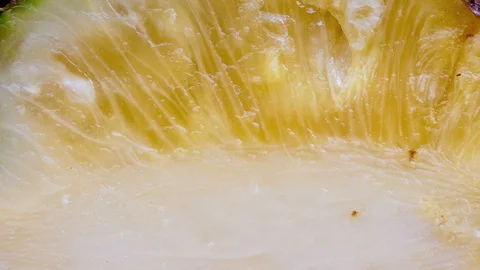 Macro animation of a pineapple cut in half, saw the  texture Stock Footage 103065862
