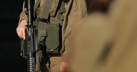 Macro army vest jacket with ammunition magazines. close up hand  Stock Footage 118392728