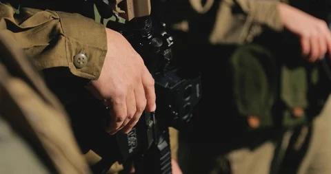Macro army vest jacket with ammunition magazines. female hands Stock Footage 118392815