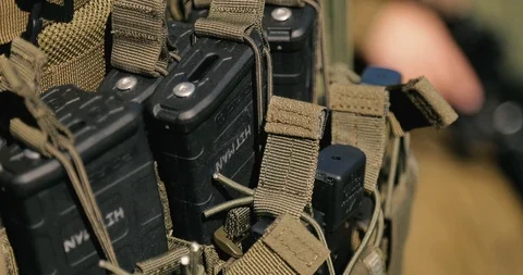 Macro army vest jacket with ammunition magazines. close up  Stock Footage 118392831