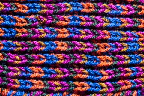 Macro backdrop of a handmade woolen fabric Stock Photos