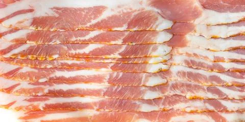 Macro background of chopped pieces of bacon. tasty food background Stock Photos