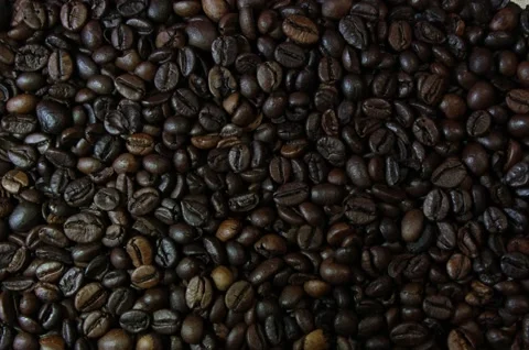 Macro background of high quality roasted dark coffee beans texture in 4K Stock Footage 330585498