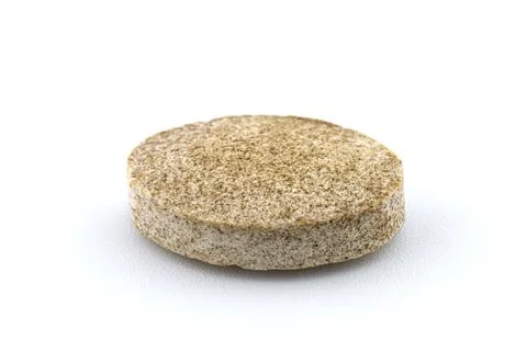 A macro background made of a single brown candy with. Stock Photos