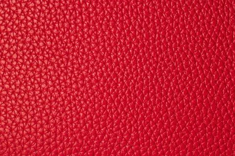 Macro background texture of bright red pebbled genuine leather material Stock Photos