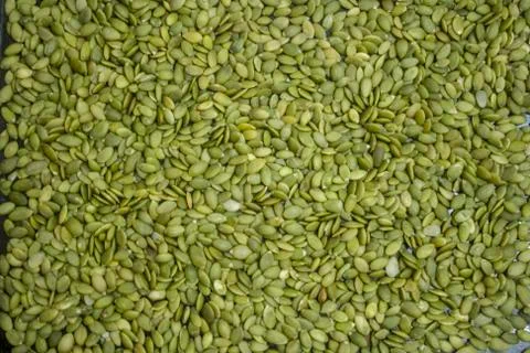Macro background texture of green pumpkin seeds Stock Photos