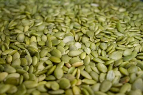 Macro background texture of green pumpkin seeds Stock Photos