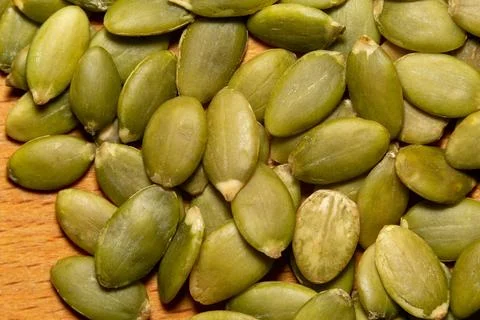 Macro background texture of green pumpkin seeds Stockfoto's