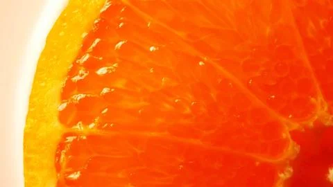 Macro of a backlit transparent orange slice showing the pulp detail Stock Photos