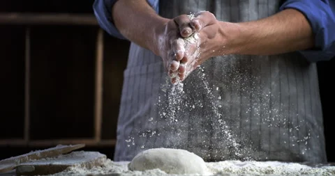 Macro of baker claps his hands with flour while prepare dough for bread or pizza Stock Footage 269332490