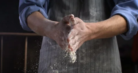 Macro of baker claps his hands with flour while prepare dough for bread or pizza Stock Footage 269332491