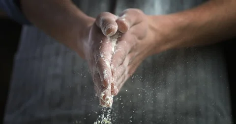 Macro of baker claps his hands with flour while prepare dough for bread or pizza Stock Footage 269332511