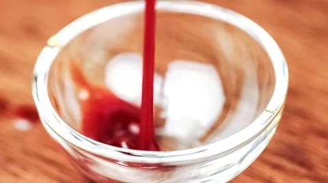 Macro of BBQ dipping sauce condiment filling up glass bowl Stock Footage 62794555