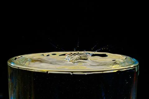 Macro Beautiful drops in flight, colored drops Stock Photos