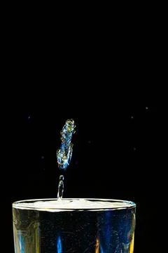 Macro Beautiful drops in flight, colored drops Stock Photos