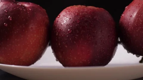 Macro, beautiful red apple on a black background Stock Footage 186987220