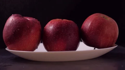Macro, beautiful red apples on a black background Stock Footage 186987298