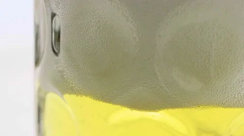 Macro beer pour and foam settling Stock Footage 68003063