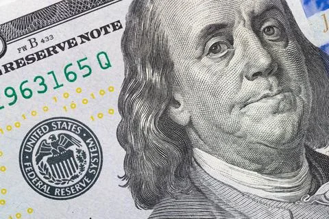 Macro of Benjamin Franklin portrait and security features on US 100 dollar bi Stock Illustration