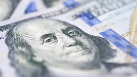 Macro of Benjamin Franklin's face on the US one hundred dollar bill Stock Footage 147987926