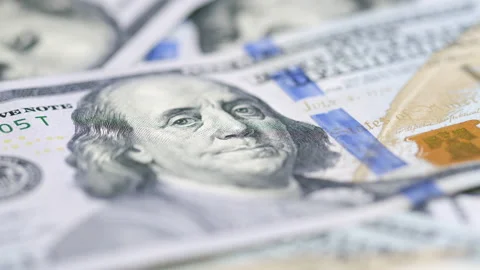 Macro of Benjamin Franklin's face on the US one hundred dollar bills Stock Footage 147988211