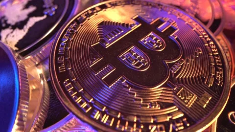 Macro Bitcoin BTC with gold and blue neon light with many reflections. Halving Stock Footage 132484563