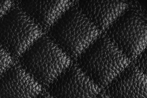Macro of black quilted leather texture background with stitched pattern and.. Stock Photos