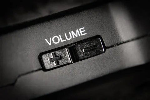 Macro Of black Volume Buttons rocker Of A black handy audio device Stock Photos