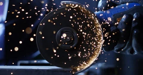 Macro of blacksmith welder smooths metal steel with angle grinder with sparks Stock Footage 269934963