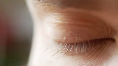 Macro of a blue eye, closeup young white caucasian male, blinking looking around Stock-Footage 98493795