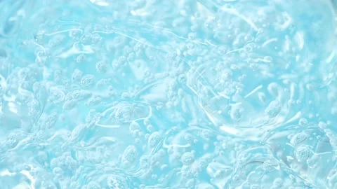 Macro blue transparent cosmetics serum gel, cream, fluid lotion texture, bubbles Vídeo Stock 198120982