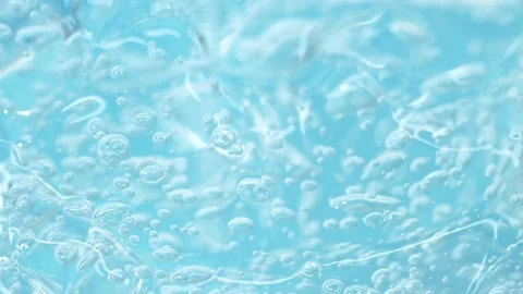 Macro blue transparent cosmetics serum gel, cream, fluid lotion texture, bubbles Stock Footage 201317788