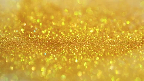 Macro bokeh of shimmering glitter particles in vibrant fluid motion Stock Footage 331742854