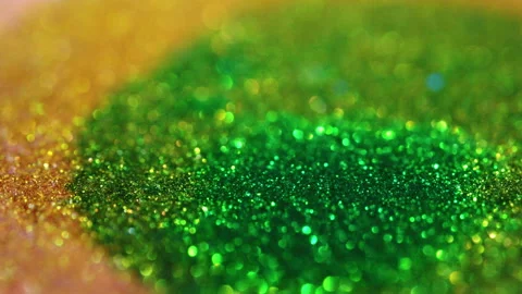 Macro bokeh of shimmering glitter particles in vibrant fluid motion Stock Footage 331742964