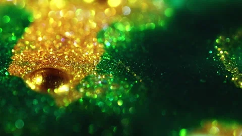 Macro bokeh of shimmering glitter particles in vibrant fluid motion Stock Footage 331747215