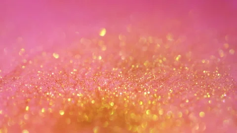 Macro bokeh of shimmering glitter particles in vibrant fluid motion Stock Footage 331747546