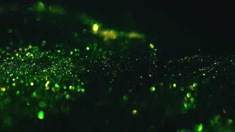 Macro bokeh of shimmering glitter particles in vibrant fluid motion Stock Footage 331748630