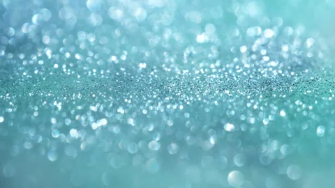 Macro bokeh of shimmering glitter particles in vibrant fluid motion Stock Footage 331751395