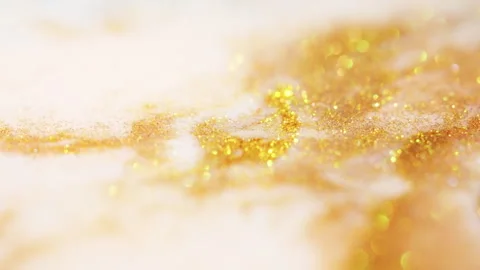 Macro bokeh of shimmering glitter particles in vibrant fluid motion Stock Footage 331752989