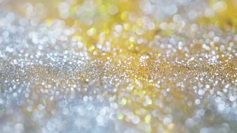 Macro bokeh of shimmering glitter particles in vibrant fluid motion Stock Footage 331753116