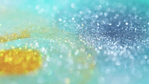 Macro bokeh of shimmering glitter particles in vibrant fluid motion Stock Footage 331753905